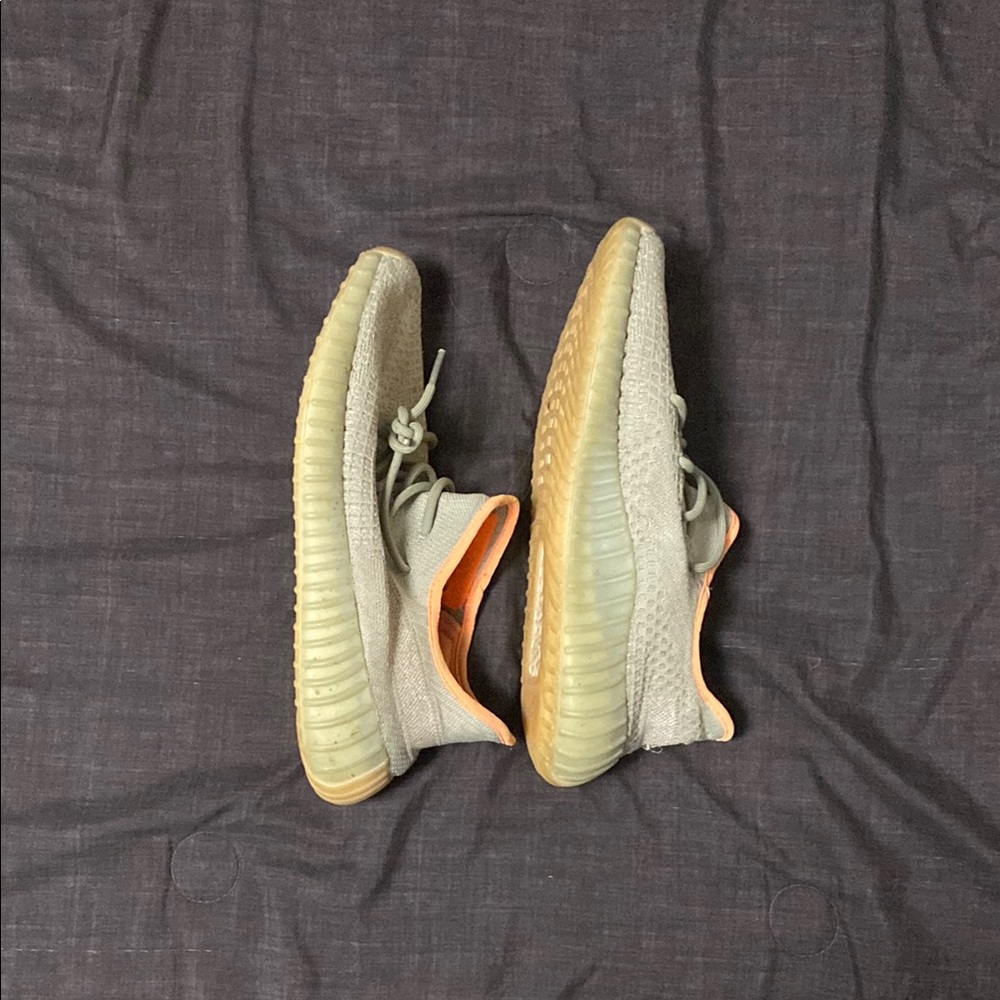 Yeezy Cream and Orange Athletic Shoes